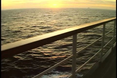 Rail of the cruise ship at sunset, no people, Atlantic Ocean Stock Footage