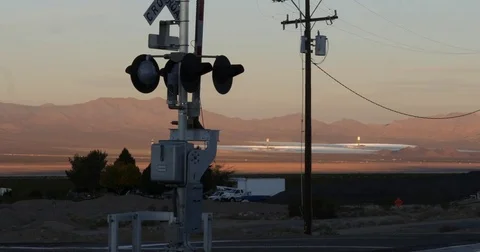 Rail road crossing with solar array in background Stock Footage 82875876