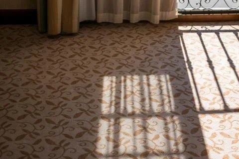 Rail shadow on a carpet. Stock Photos