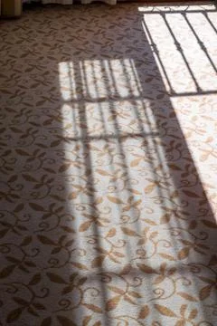 Rail shadow on a carpet. Stock Photos