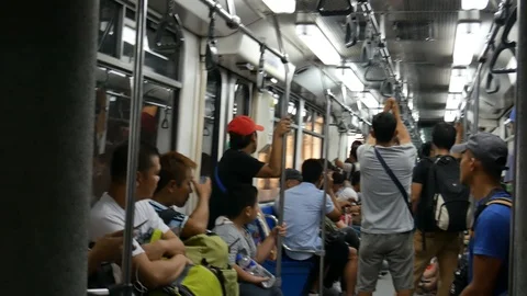 Rail Transit Train and commuters in Manila, the Philippines Stock Footage 102562312