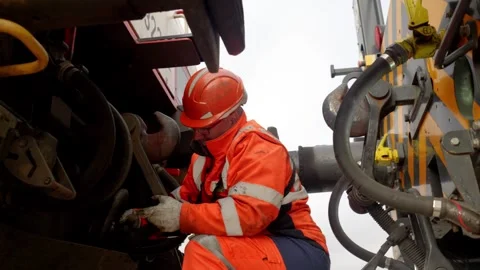 Rail Worker Connecting Train Cars in Industrial Rail Yard, Le Havre, France Stock Footage 337976589