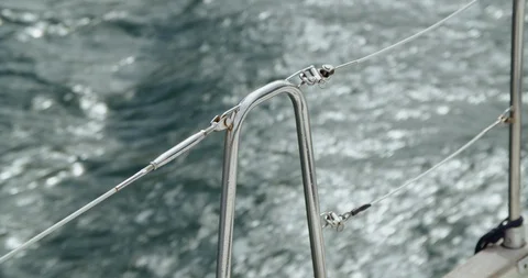 Railing on a sailing boat and moving water Stock Footage 129737642