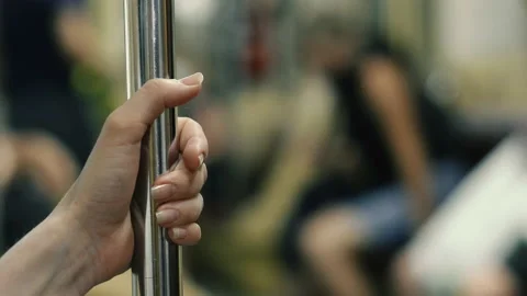 Railing. A woman's hand holding onto a railing in public transport. Stock Footage 151237830