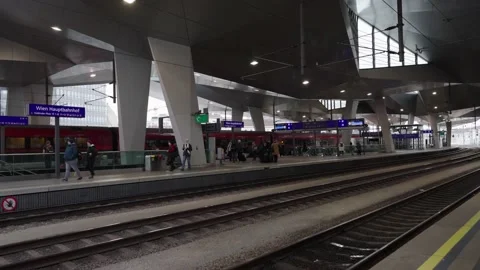 Railjet Train at Vienna Main Train Station. People walking on Platform Stock Footage 231226817