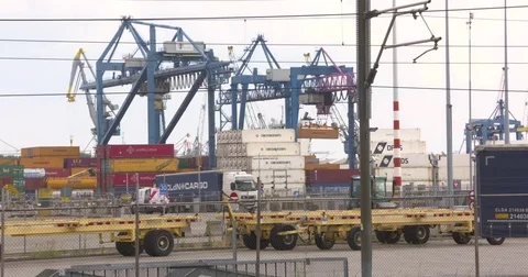 Railmounted gantry cranes load and unload from train to truck at RSC Rotterdam 動画素材 78564797
