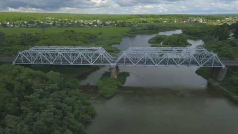 Railroad bridge over small river in Siberia, Russia. Hyper lapse aerial view. Stock Footage 110297442