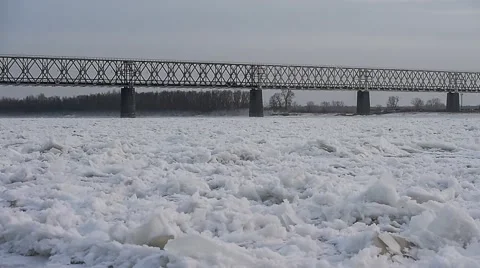 Railroad bridge. The train moves across the river. Winter. Stock Footage 63545682