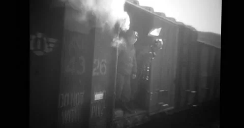 Railroad car decorated with flags and loaded with Chinese prisoners Stock Footage 43392445
