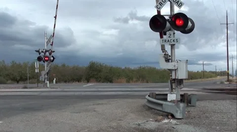 Railroad Crossing with Active Guards and Lights Flashing Stock Footage 8813615