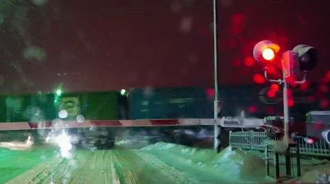 Railroad crossing, train in snowfall, blizzard, non-flying weather  Stock Footage 59697822
