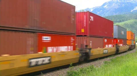 Railroad, freight train, container train on s-turn, #4 multi coloured containers Stock Footage