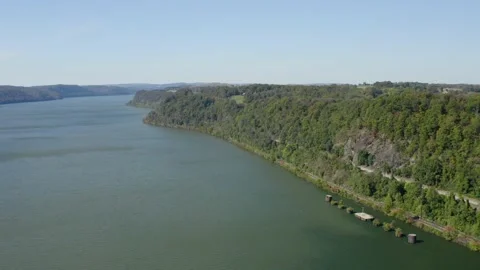 Railroad runs along Susquehanna River in Central PA Aerial Stock Footage