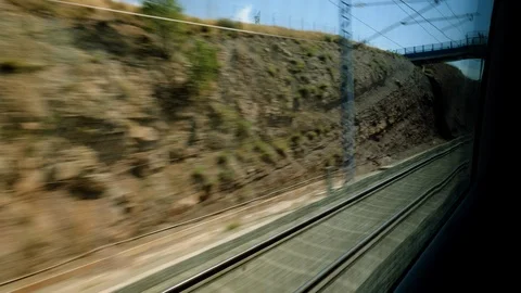 Railroad track. View from high speed train driving through suburb of Spain. 4K Video stock 125754376
