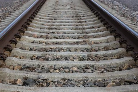 Railroad tracks close up on the selective focus and blurred background Stock Photos