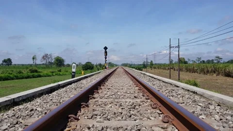 Railroad tracks in the middle of the field Stock Footage 206377589