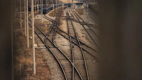 Railroad tracks view from the bridge between fence Stock Footage 244704248