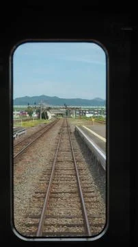 Railroad tracks view from inside the train in japan. Stock Photos