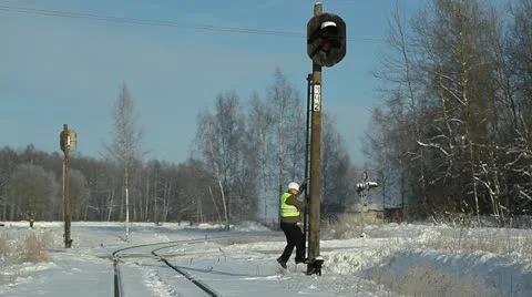 Railroad worker  climbing on  signal beacons pole Stock Footage