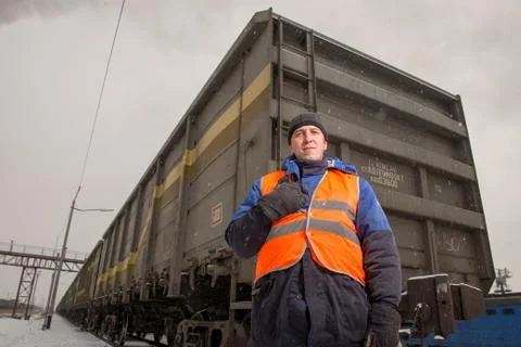 Railroad worker with wagon on the background Stock Photos