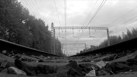 Rails and trees in the suburbs black and white Stock Footage 82365540