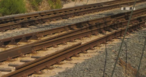 Rails of three running view from the window near a station Stock Footage 216552592