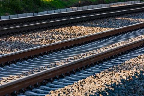 Rails of the train in a track bed made of gravel Two parallel tracks with ... Stock Photos
