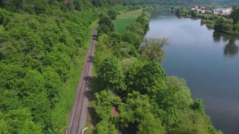 Railway along the field and river Stock Footage 155246713