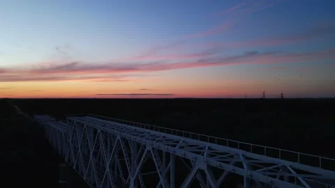 Railway bridge on the background of sunset Stock Footage 211811780