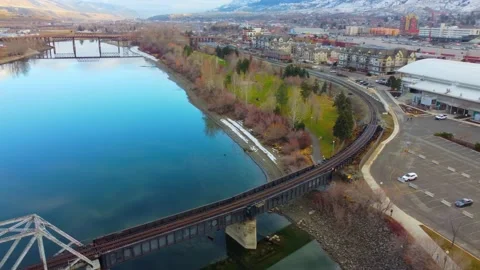 Railway bridge over the river at dawn with mountains in the background. 動画素材 145166016