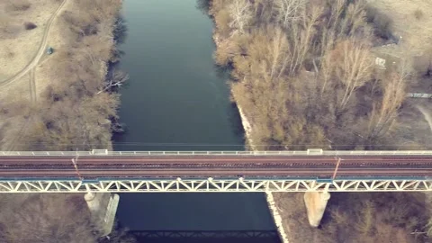 Railway bridge over a small river on the background, top view Video stock 218467973