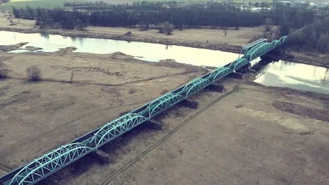 Railway bridge over a small river on the background, top view Video stock 218468210