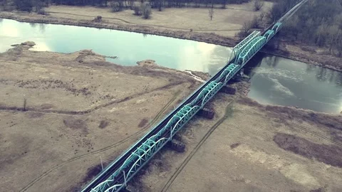 Railway bridge over a small river on the background, top view Video stock 218468238