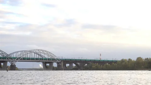 Railway bridge with a running train in 4K. Stock Footage 141684212