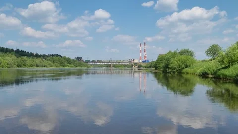 Railway bridge with a train on the river. Power station Stock-Footage 245275337