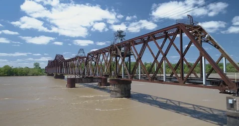Railway bridge traversing large river with cables and scafolding drone aerial 4K Stock Footage 111363512