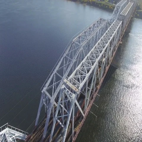 The railway bridge on which the train rides. Aerial view. Stock Footage 69633542