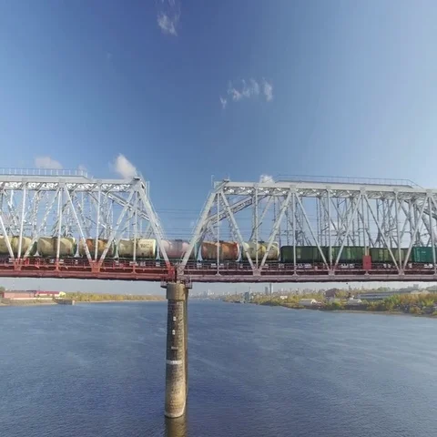The railway bridge on which the train rides. Aerial view. Stock Footage 69633861