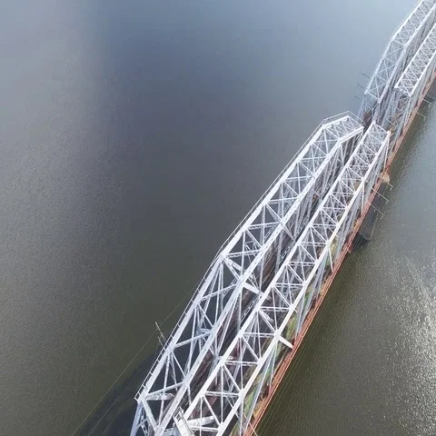 The railway bridge on which the train rides. Aerial view. 動画素材 69638298