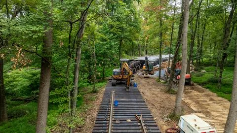 Railway Construction Activity in a Forested Area During Daylight Hours Stock Photos