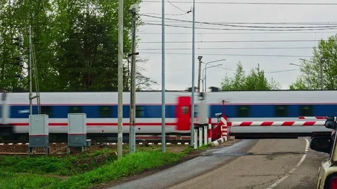 Railway crossing passing train Stock Footage 82991618