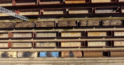 Railway depot station with trains and vans aerial view Stock Footage