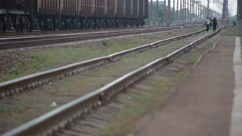 Railway going away on which going by foot crowd of people Stock Footage 117994302