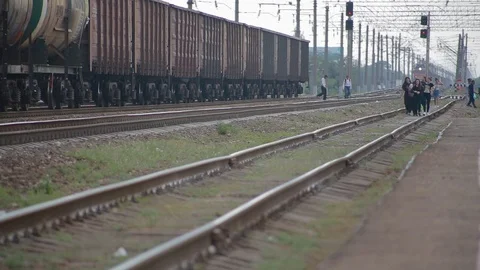 Railway going away on which going by foot crowd of people Stock Footage 117994353