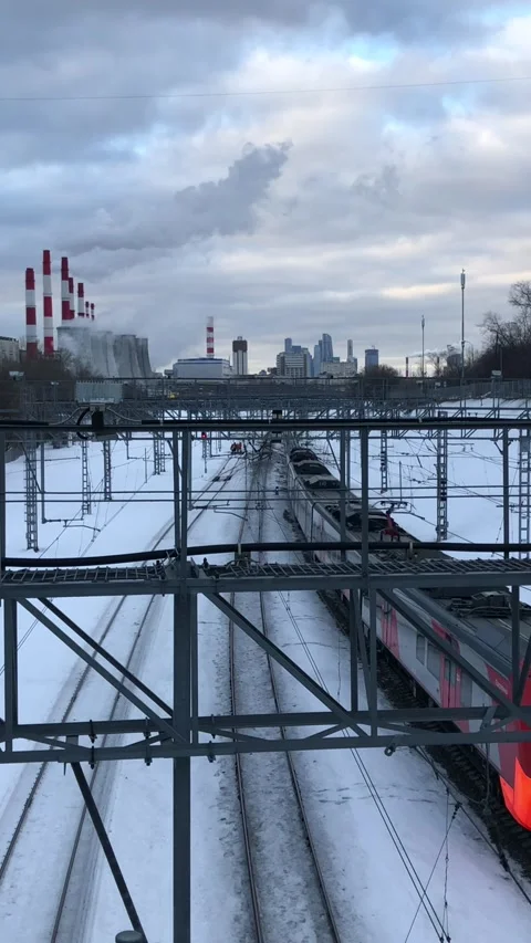 Railway interchange winter landscape with pipes And moving train Stock Footage 170246921