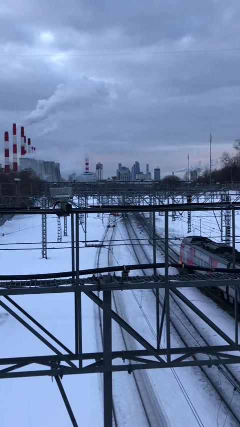 Railway interchange winter landscape with pipes And moving train Stock Footage 170246934