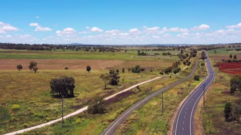 Railway line and Mitchell highway in rural NSW – aerial flying green farms 4k. Stock Footage 168034566