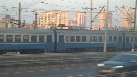 Railway lines shines by sun rays, over Dnipro river. Kyiv Stock Footage 107873947