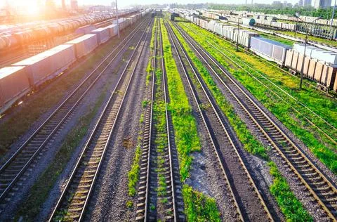 Railway at the marshalling yard sunset, freight train railway carriage. Stock Photos