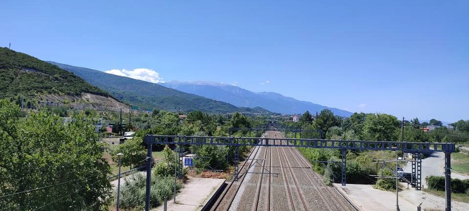 Railway next to mountains in Greece Stock Photos